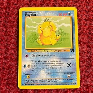 PSYDUCK. Pokemon Trading Card with Blue and Red Design